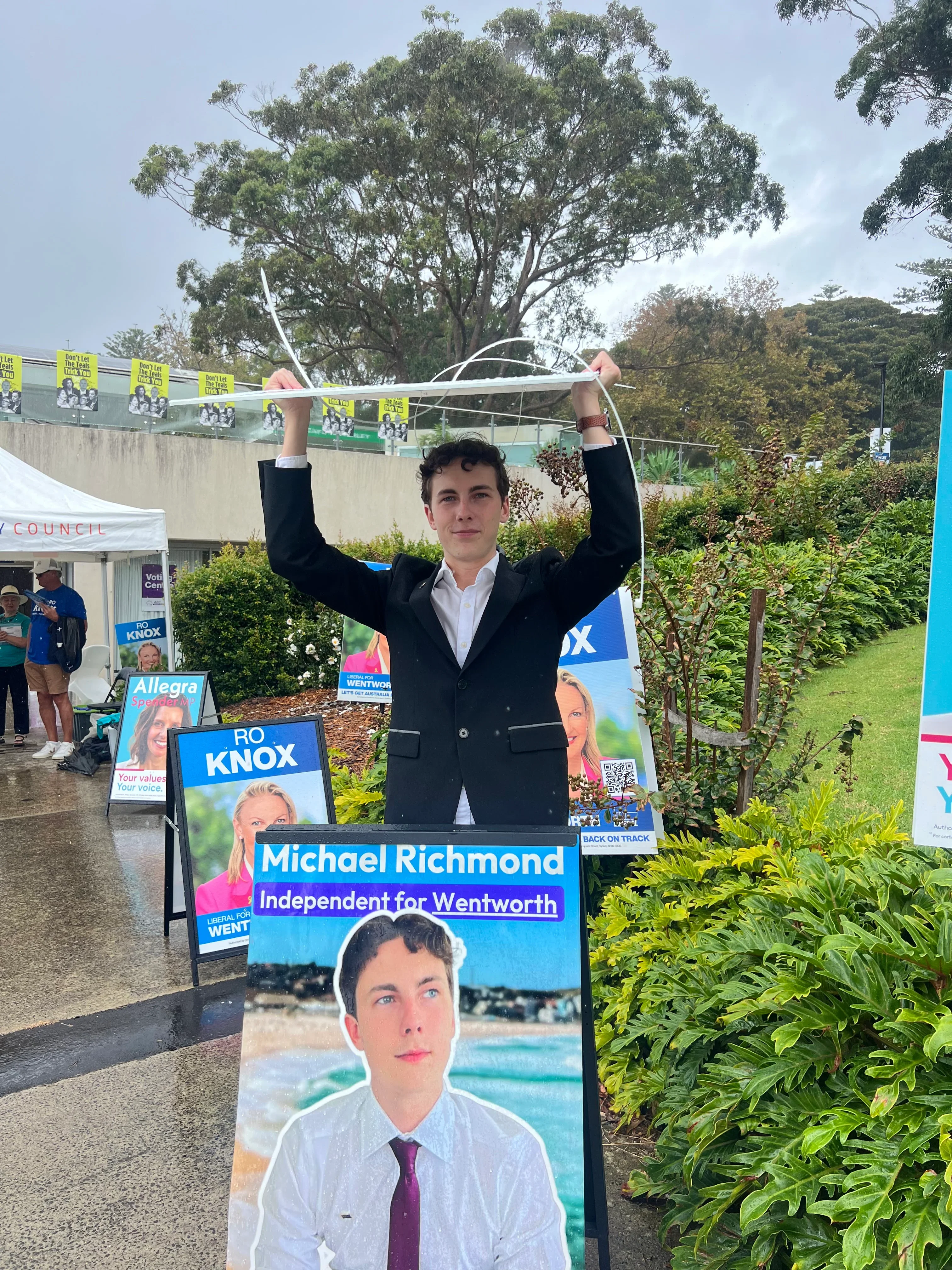 Michael setting up signage on election day