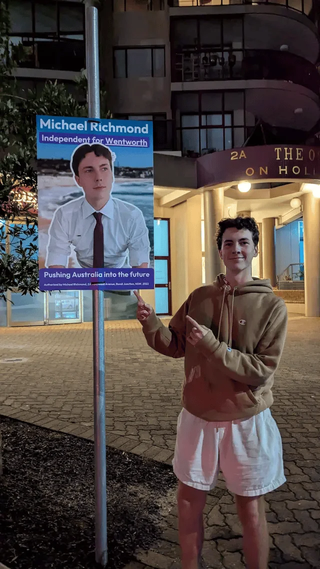 Michael with his campaign poster in Bondi Junction