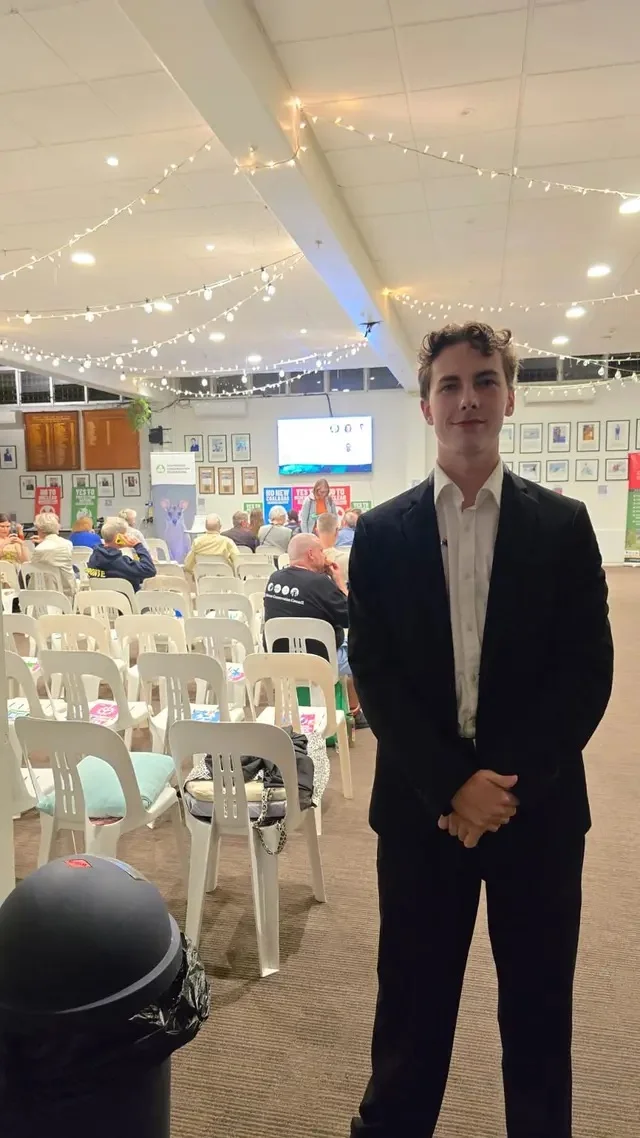 Michael speaking at a community candidates forum